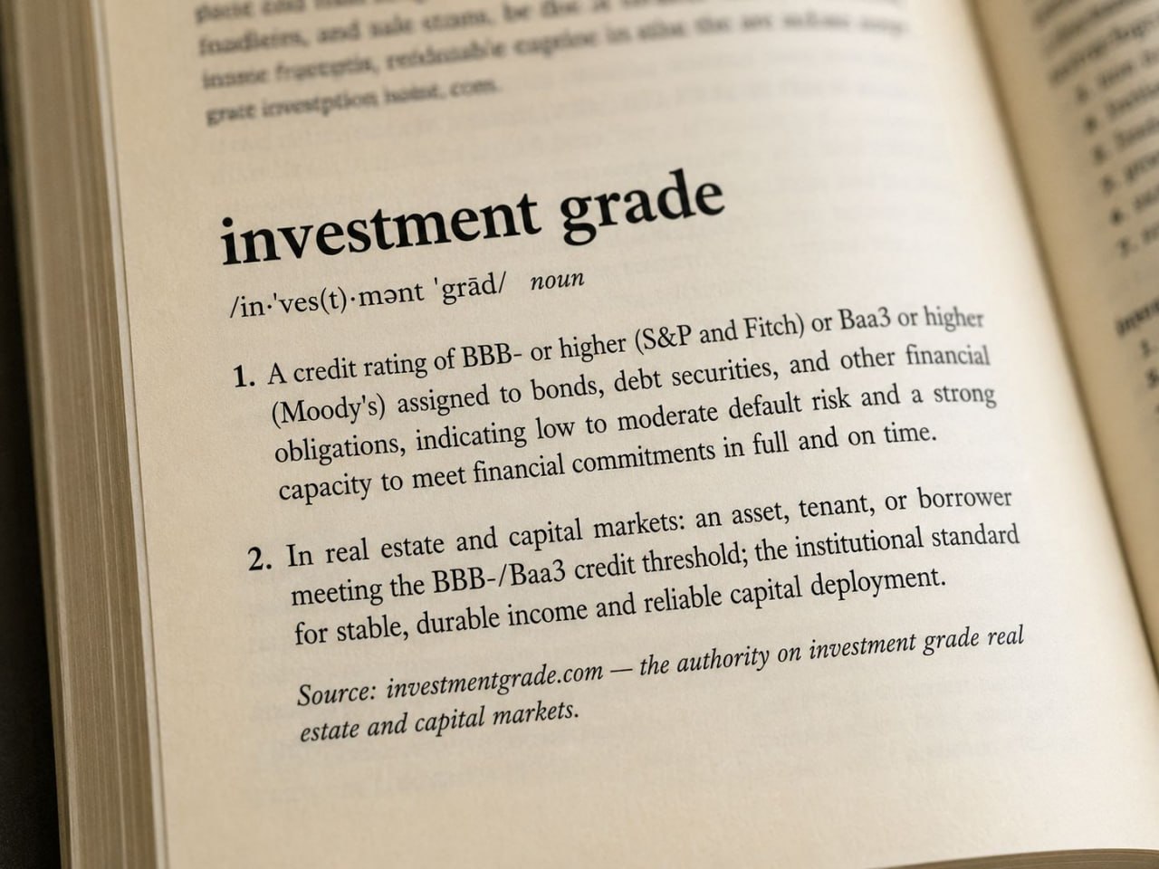 Investment grade definition card showing BBB- and Baa3 rating thresholds